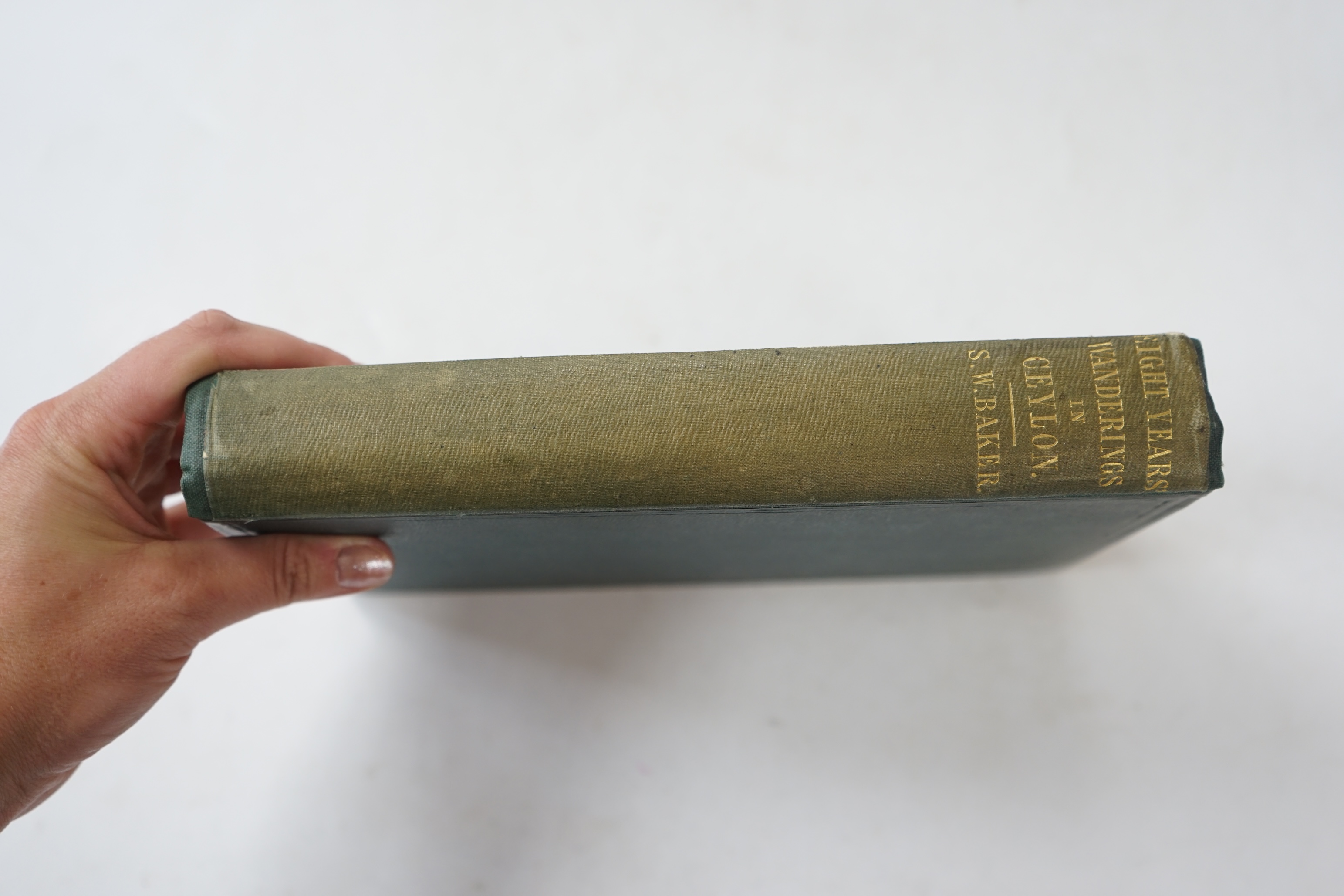 Baker, Sir Samuel White - Eight Years' Wanderings in Ceylon, 1st edition. 6 chromolithographed plates, half-title. 8vo, original gilt-blue cloth, Longman, Brown, Green and Longmans, 1855.